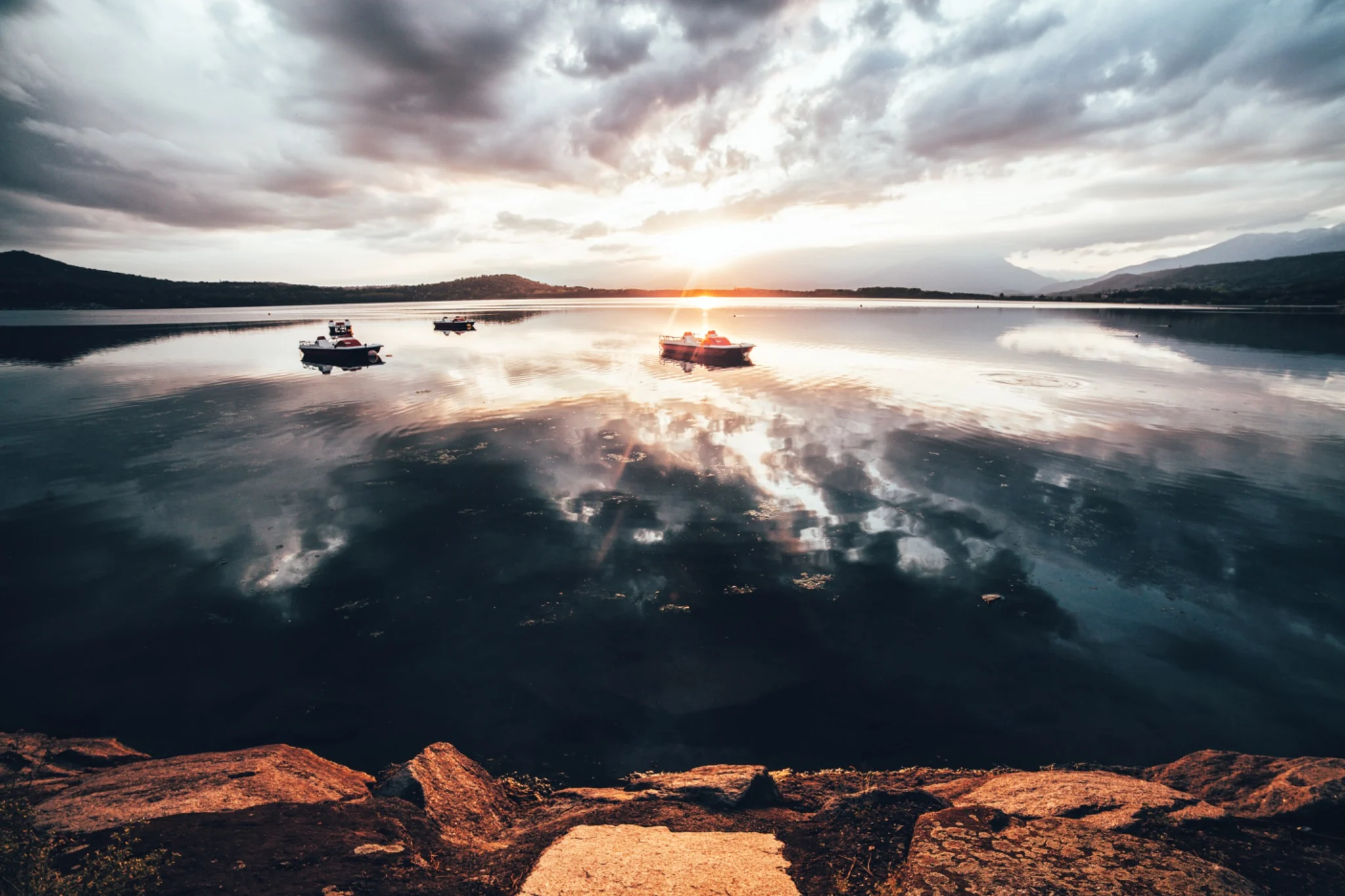 Lake at sunset with boats